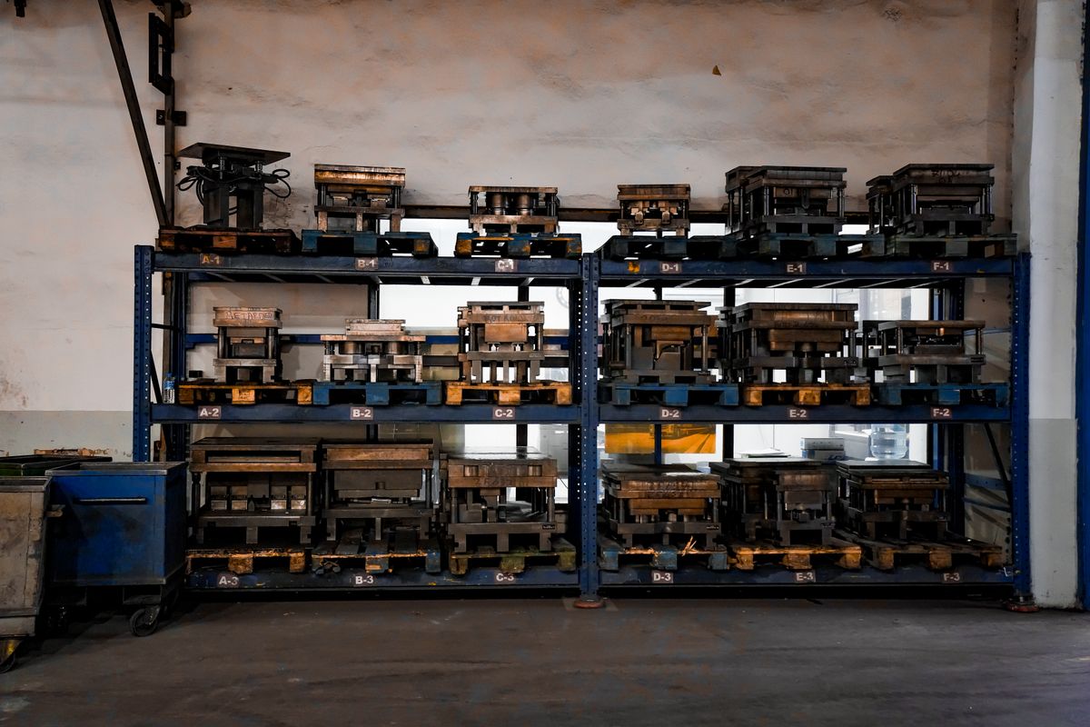 Warehouse shelving stocked with spare parts inventory